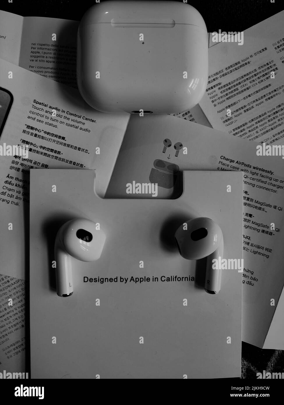 A top view of airpods with the instructions on the table Stock Photo - Alamy