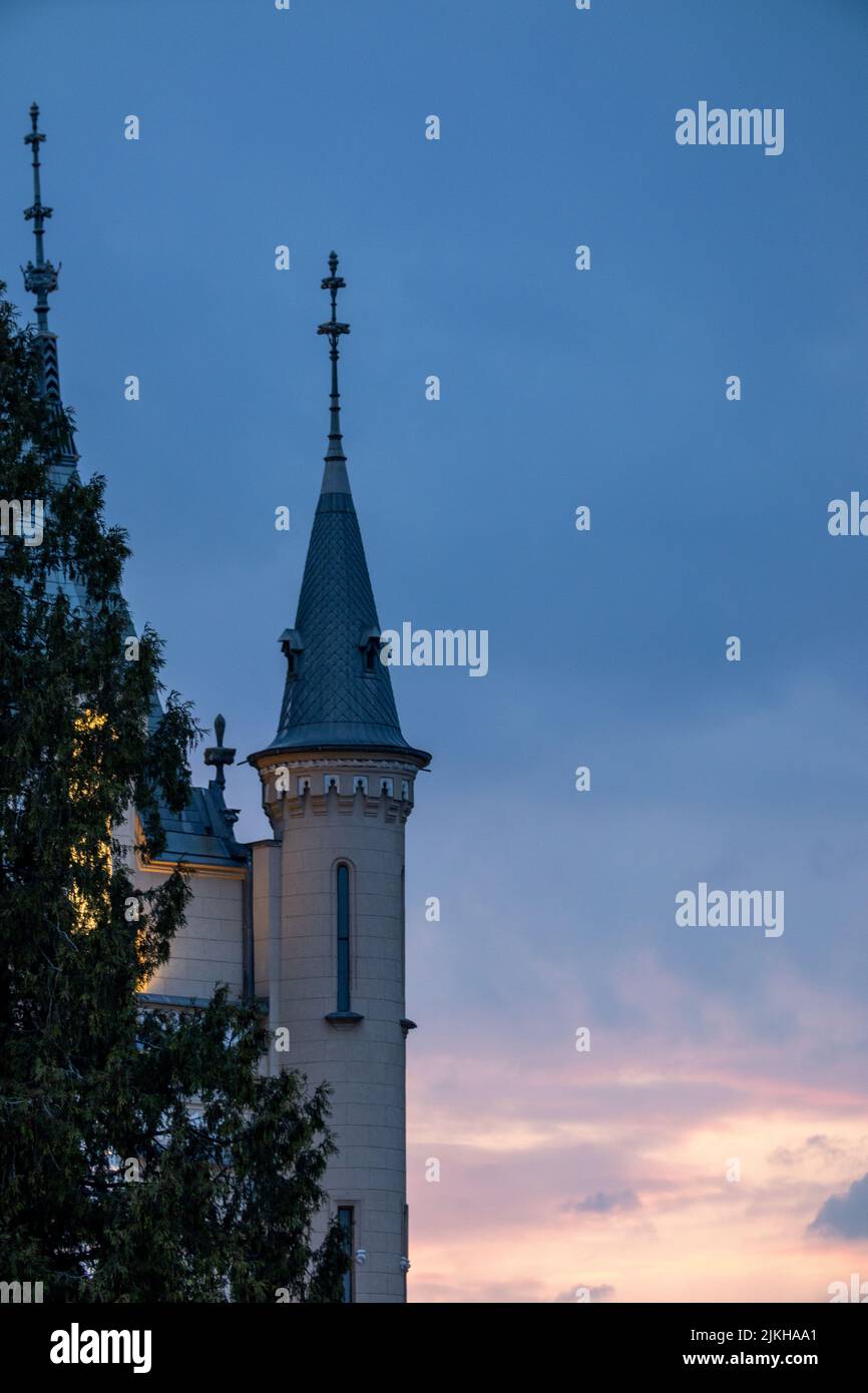 A vertical shot of a cathedral tower under a sunset sky in Iasi, Romania Stock Photo