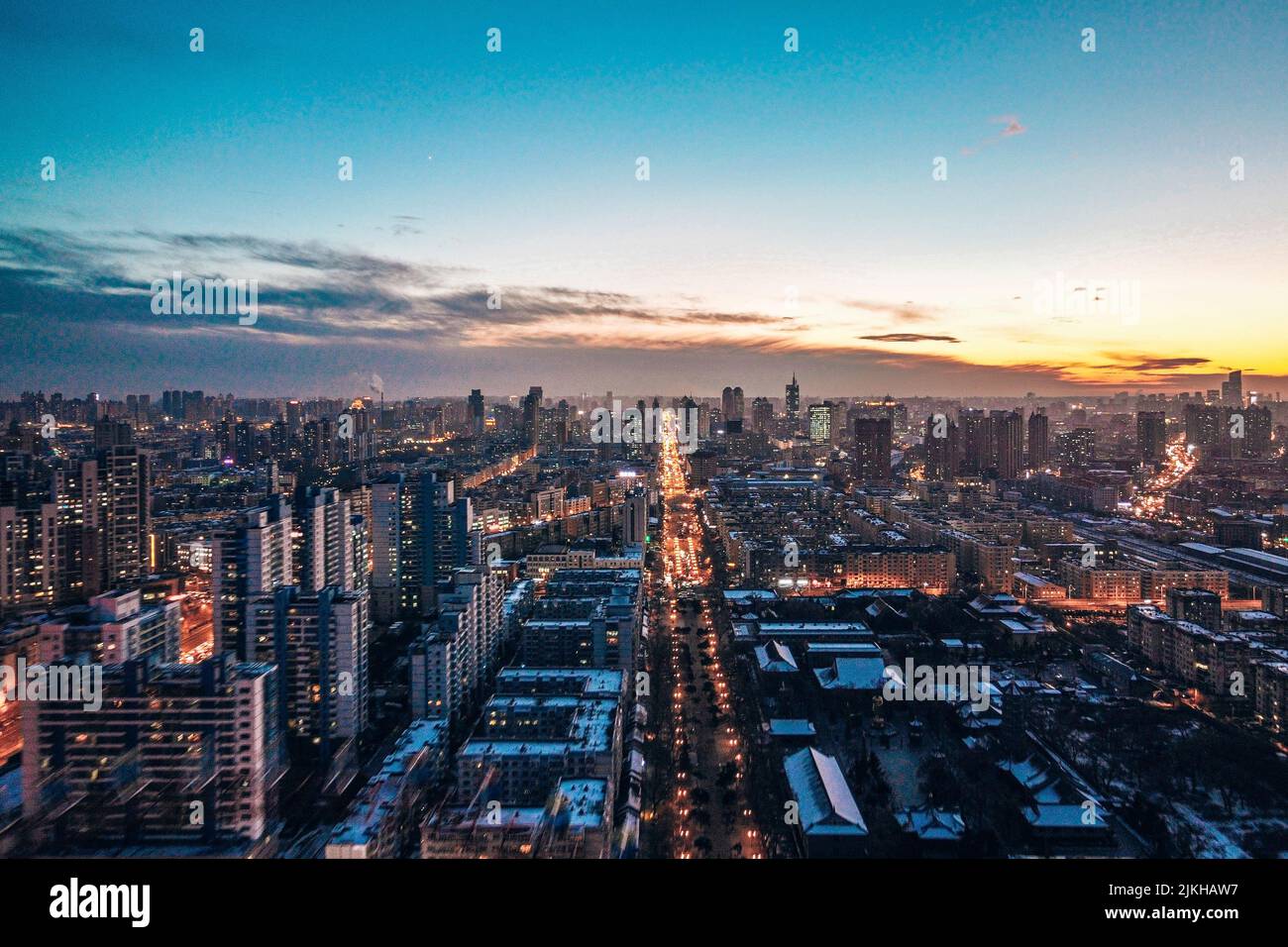 A mesmerizing view of beautiful cityscape during orange sunset Stock ...