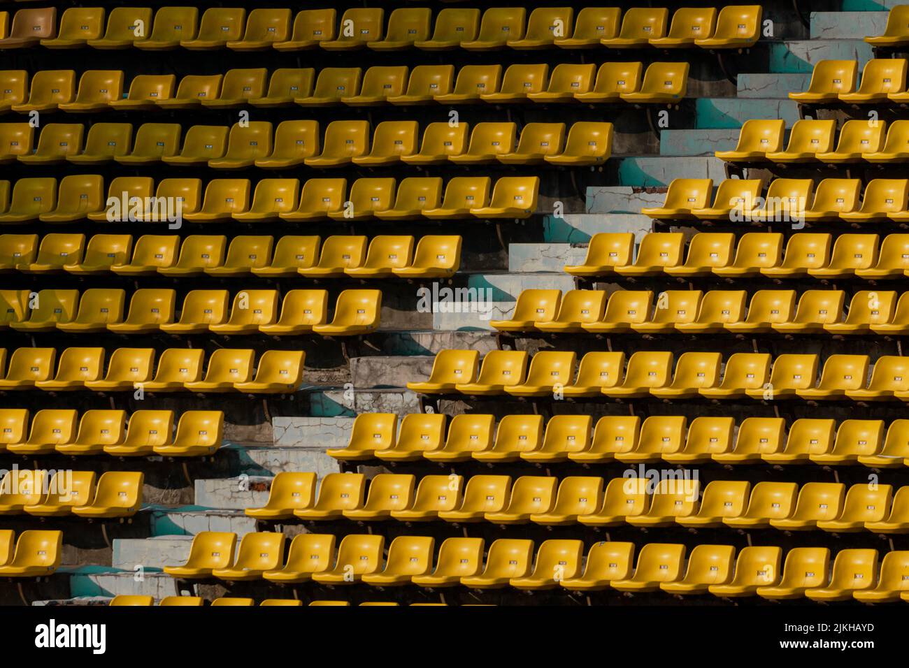 Yellow Rows A large Aligned yellow rows of empty theater seats Stock Photo - Alamy