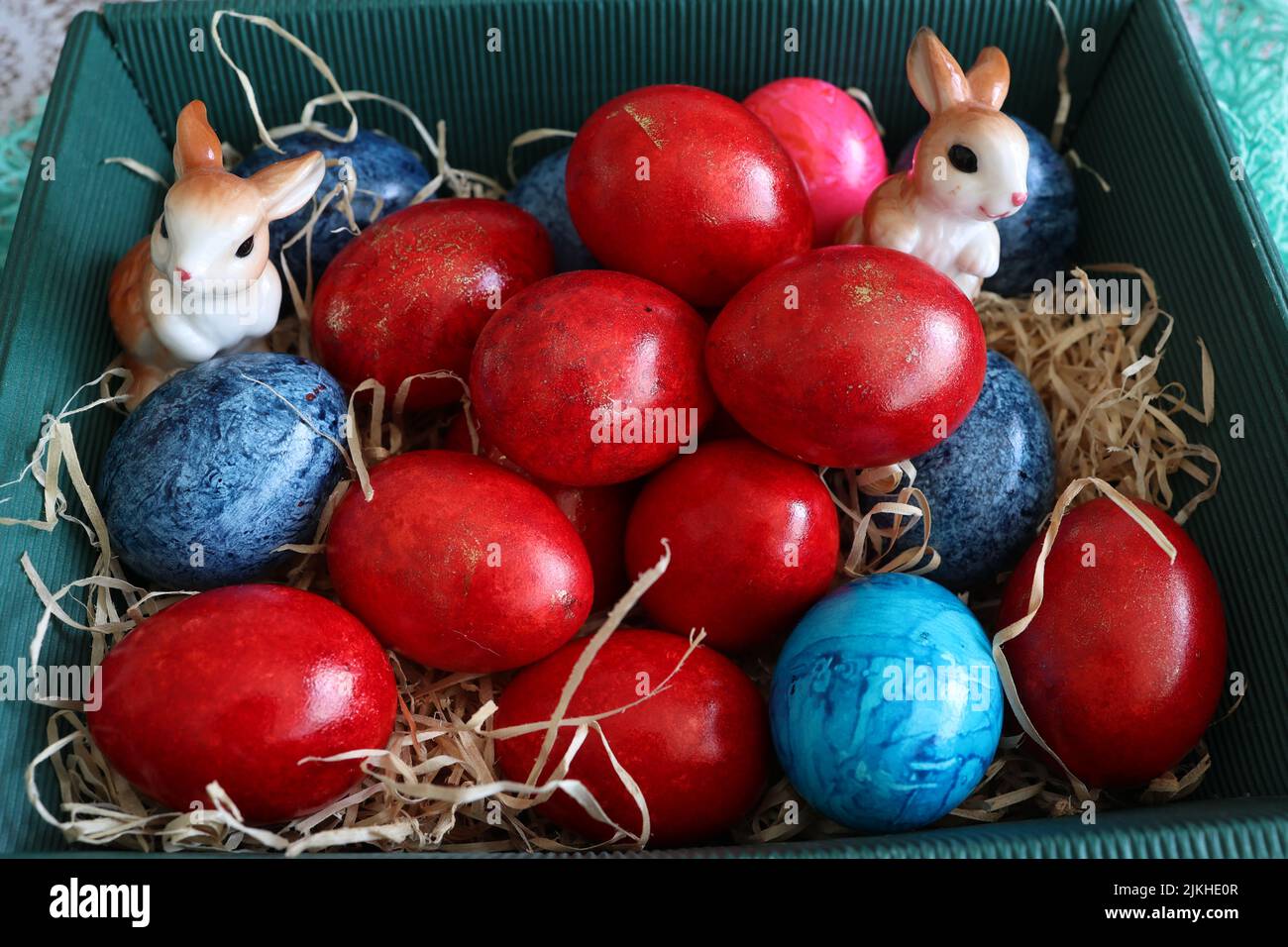 Beautiful Easter eggs lie in a basket. Stock Photo
