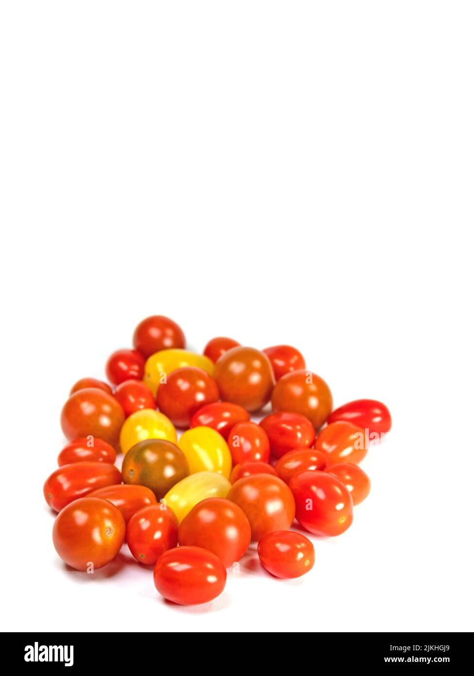 Various mini tomatoes against a white background Stock Photo