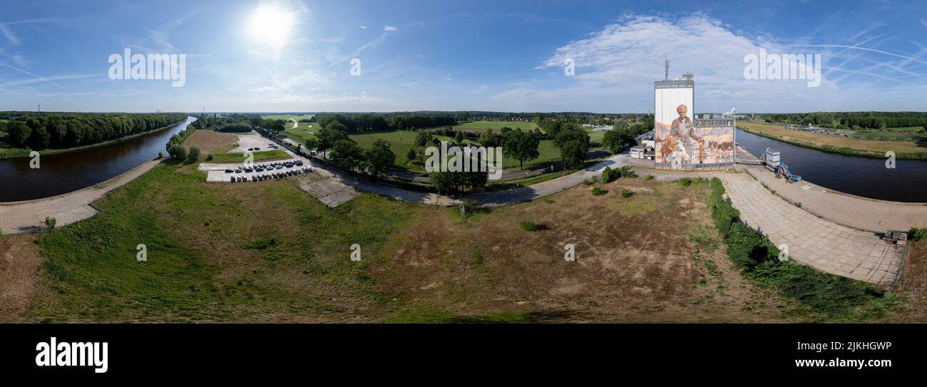 Aerial 360 degrees panorama with factory storage buildings along the Twentekanaal waterway canal in Lochem, The Netherlands. Stock Photo