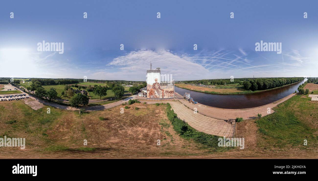 Ready for VR 360 degrees aerial panorama with factory storage buildings along the Twentekanaal waterway canal in Lochem, The Netherlands. Stock Photo