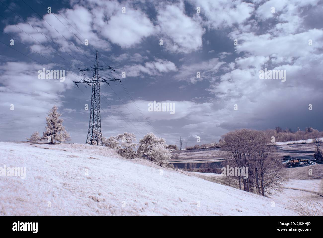 A landscape with snowy trees under sky with clouds Stock Photo - Alamy