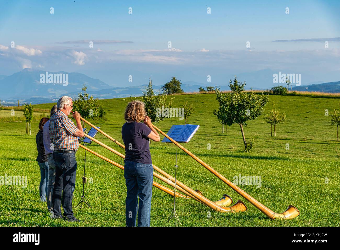 Group of Musicians playing traditional Alphorn in Appenzell Region, Switzerland Stock Photo
