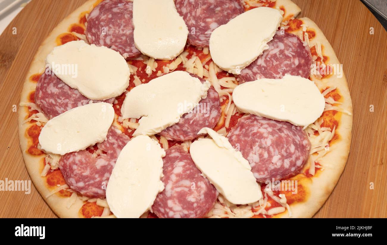 Pepperoni Pizza with Mozzarella cheese, salami, Tomatoes, pepper