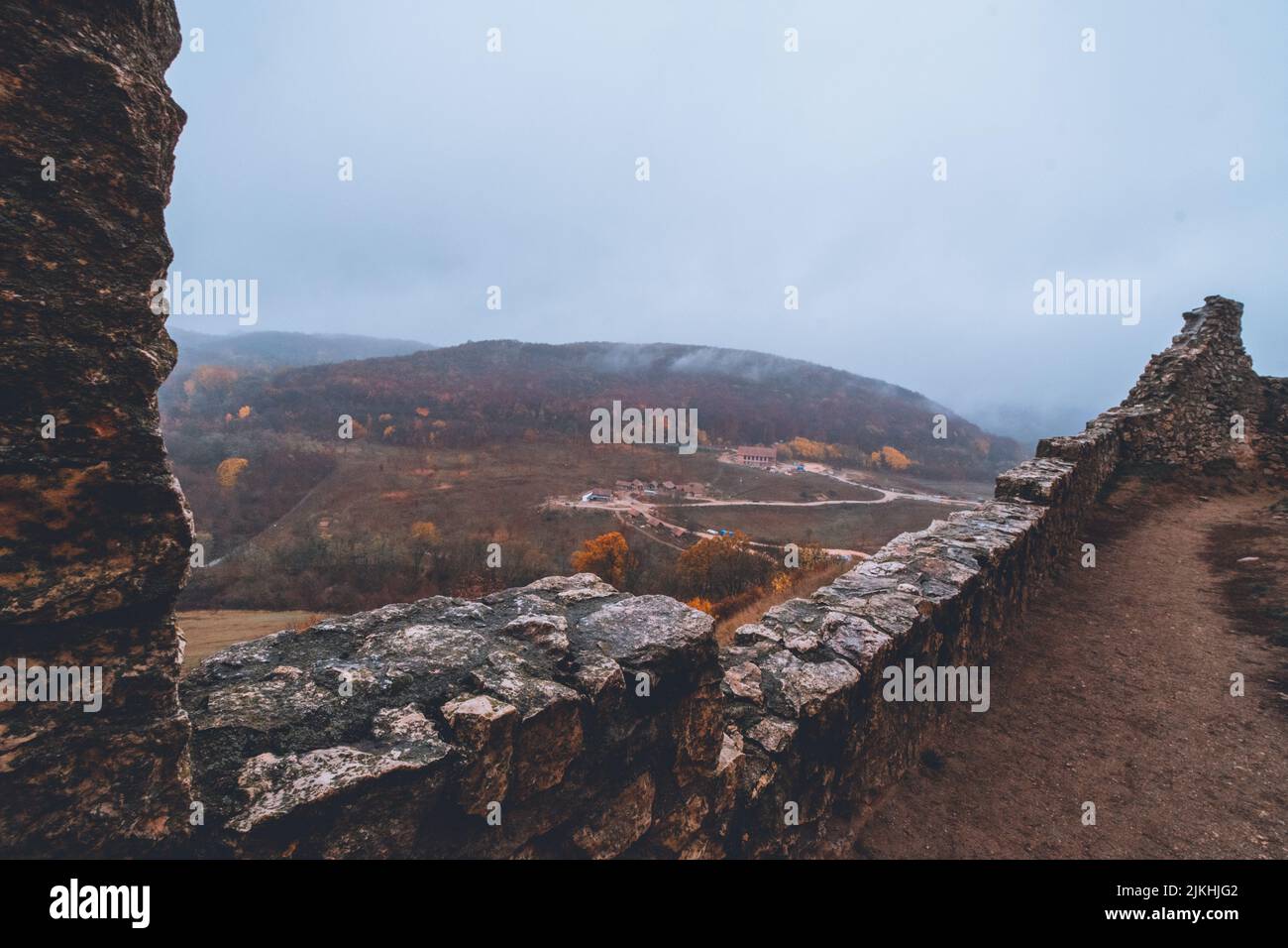 A beautiful shot of the Csesznek Castle Ruins in Hungary on a foggy day Stock Photo