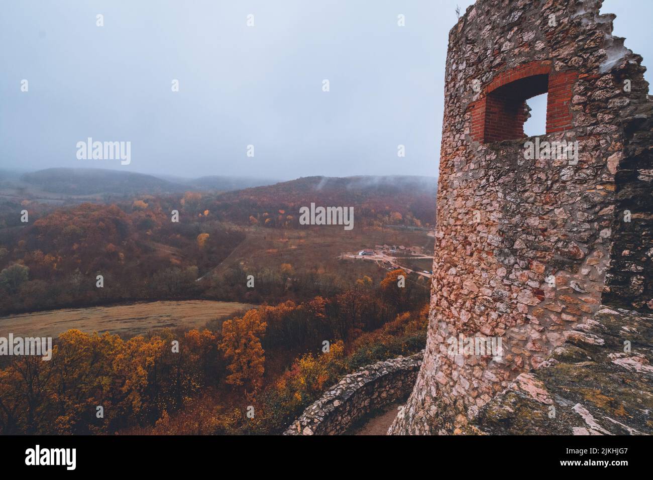 A beautiful shot of the Csesznek Castle Ruins in Hungary on a foggy day Stock Photo