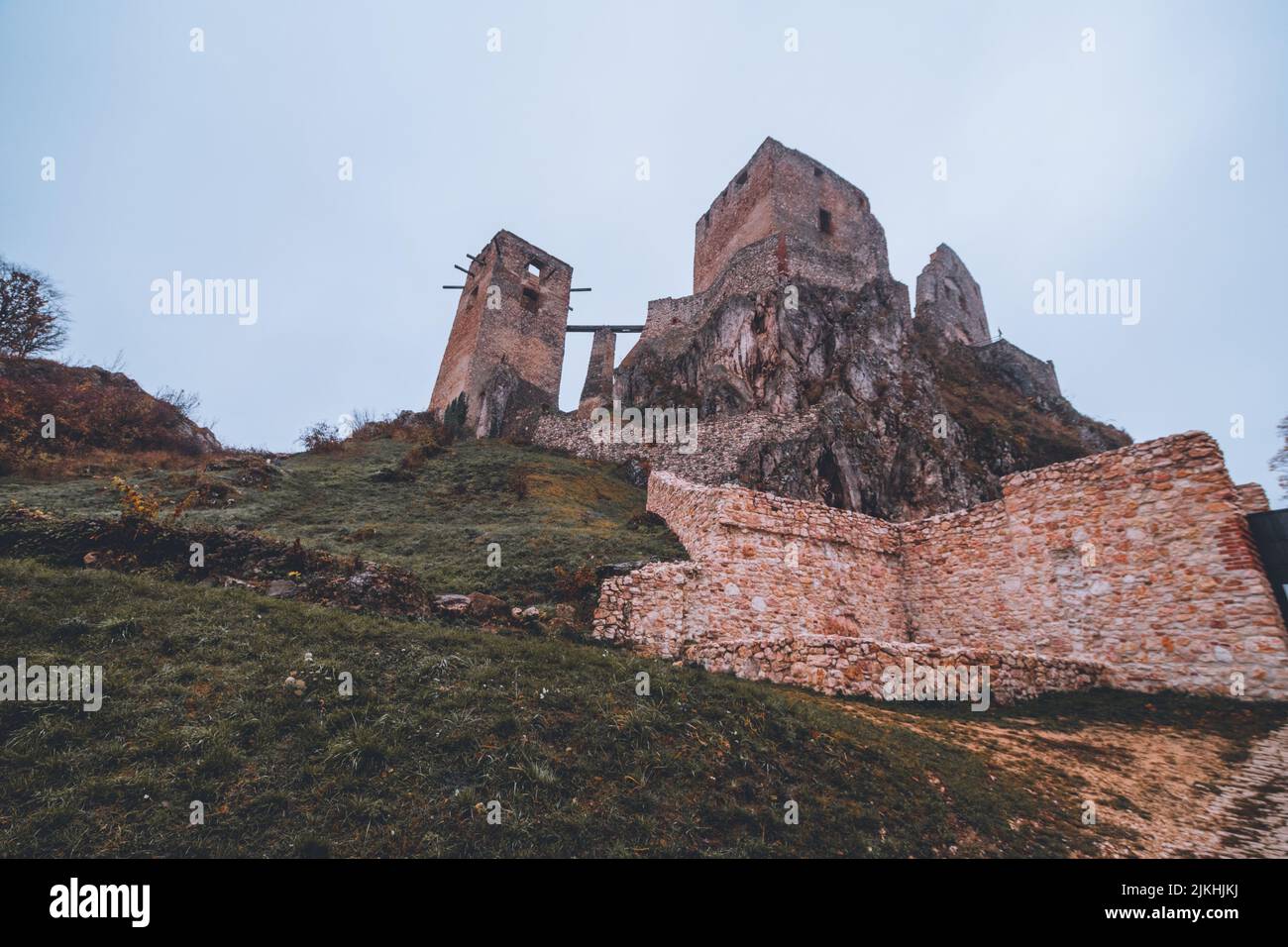 A beautiful shot of the Csesznek Castle Ruins in Hungary on a foggy day Stock Photo