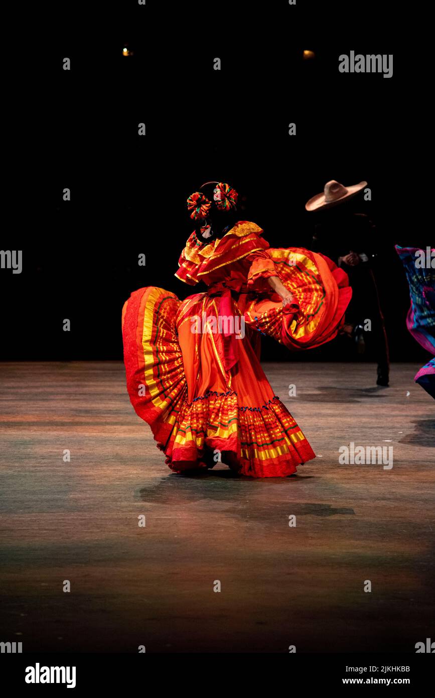 A vertical shot of a woman performing flamenco on the stage in Cancun, Mexico Stock Photo