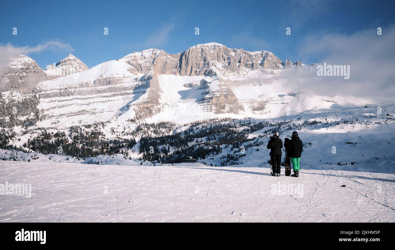 A closeup shot of skiers hiking the Italian Alps in Madonna Di Campiglio, Italy Stock Photo