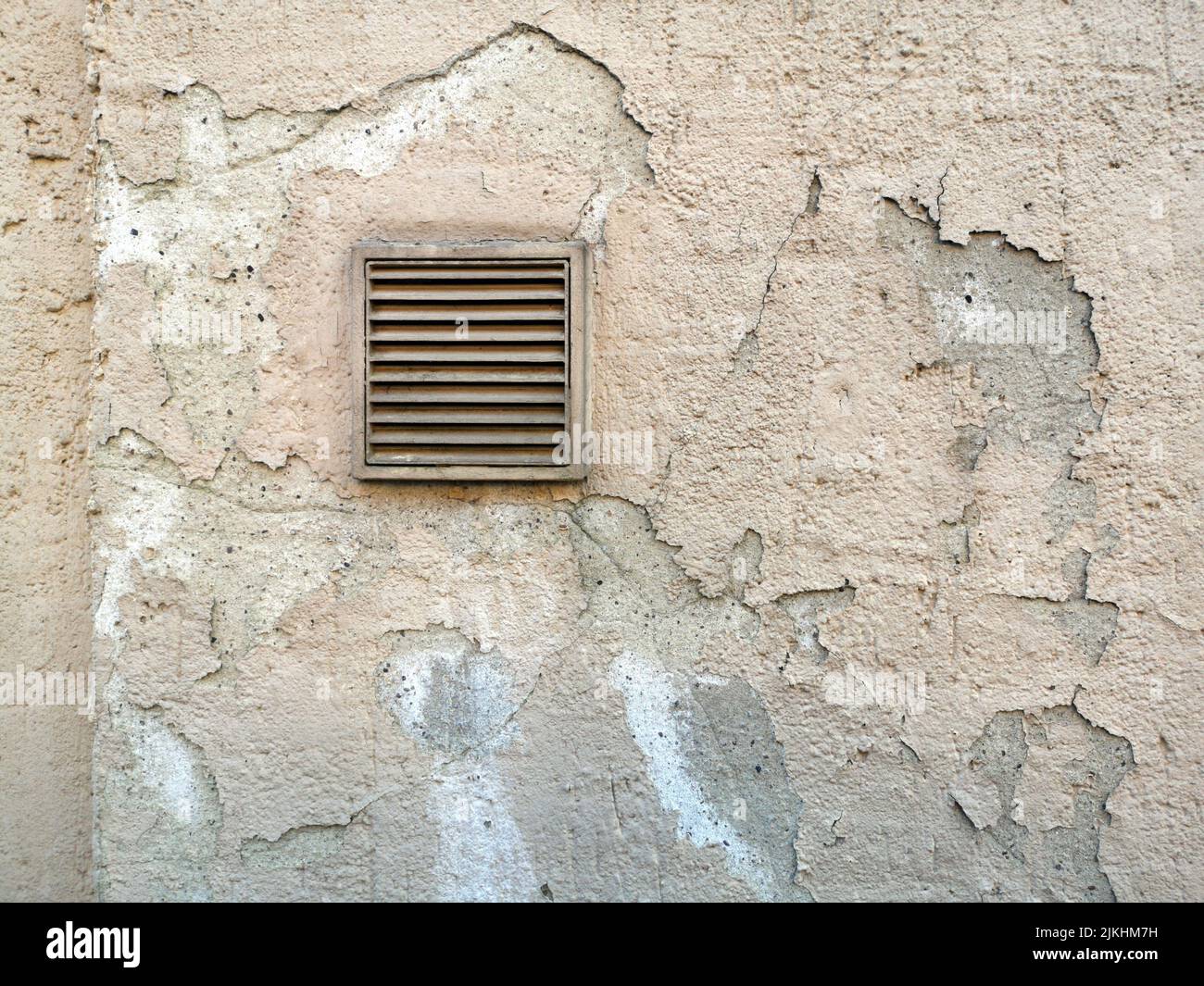 An old stone wall with a small vent hole Stock Photo Alamy