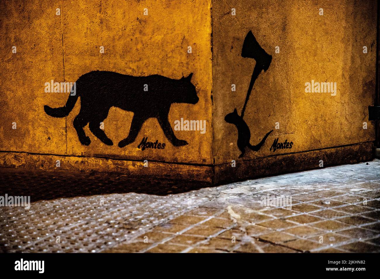 A restaurant facade with a drawing of a cat and a mouse fighting in Valencia, Spain Stock Photo