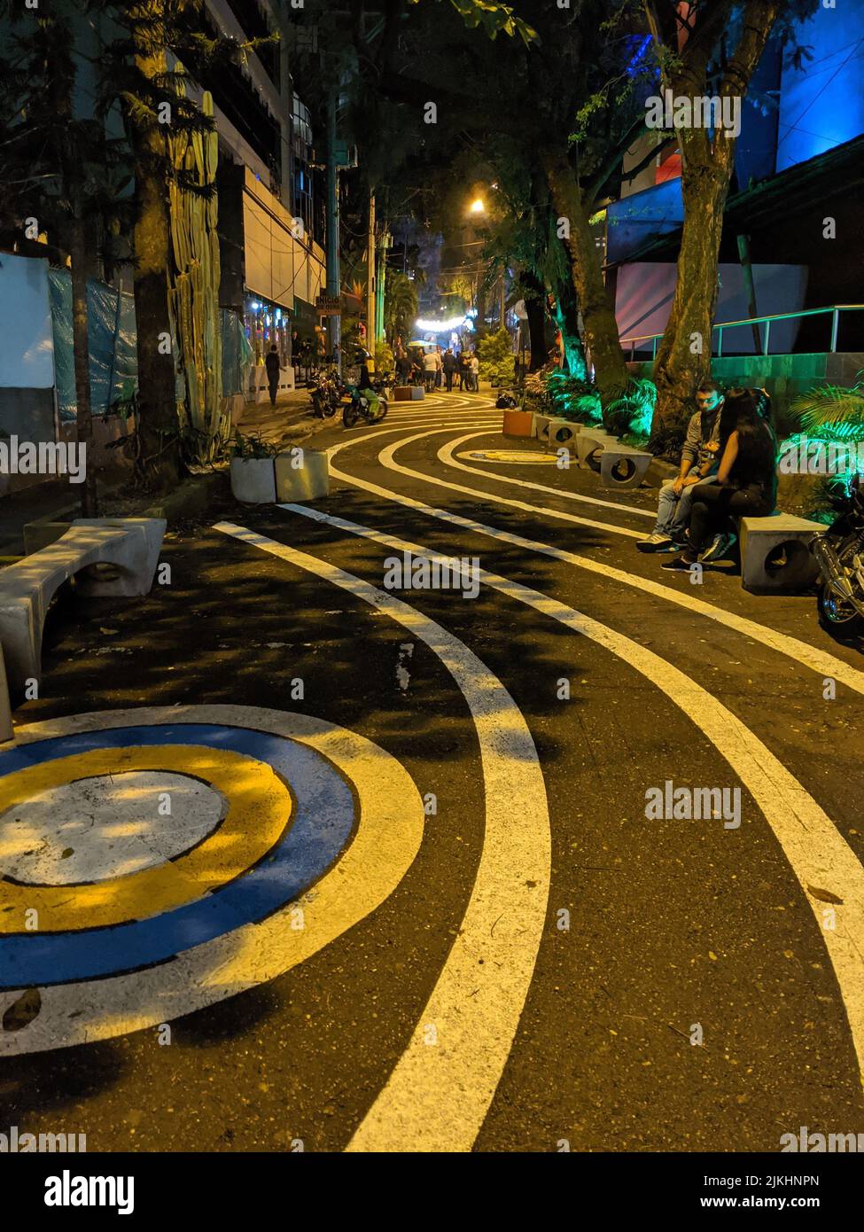 A vertical shot of a street in Medellin, Colombia at night Stock Photo