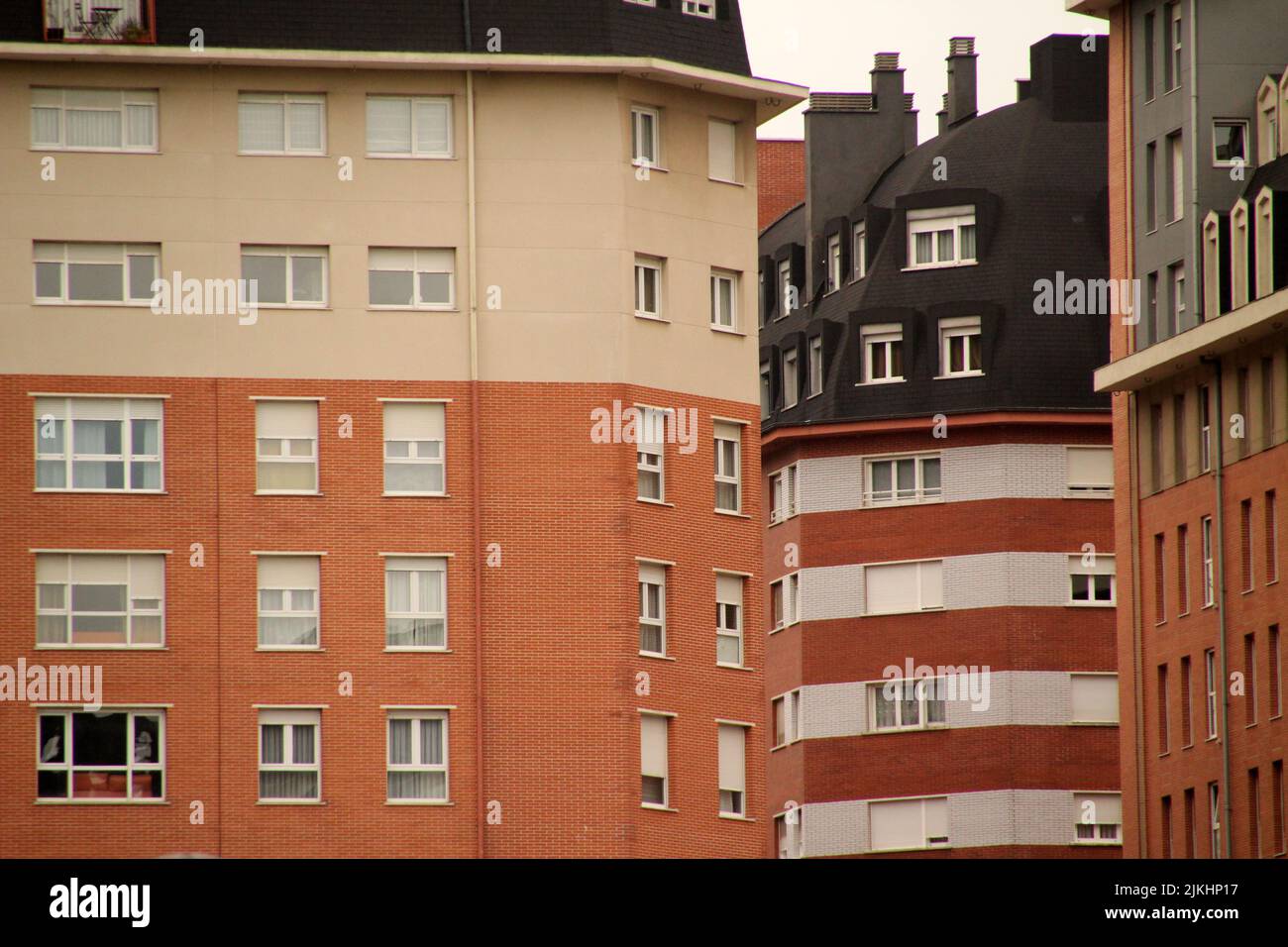 A beautiful view of apartment buildings with small windows in the