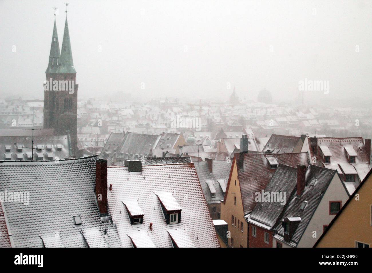 The beautiful cityscape of Nuremberg in winter with snowcovered roofs