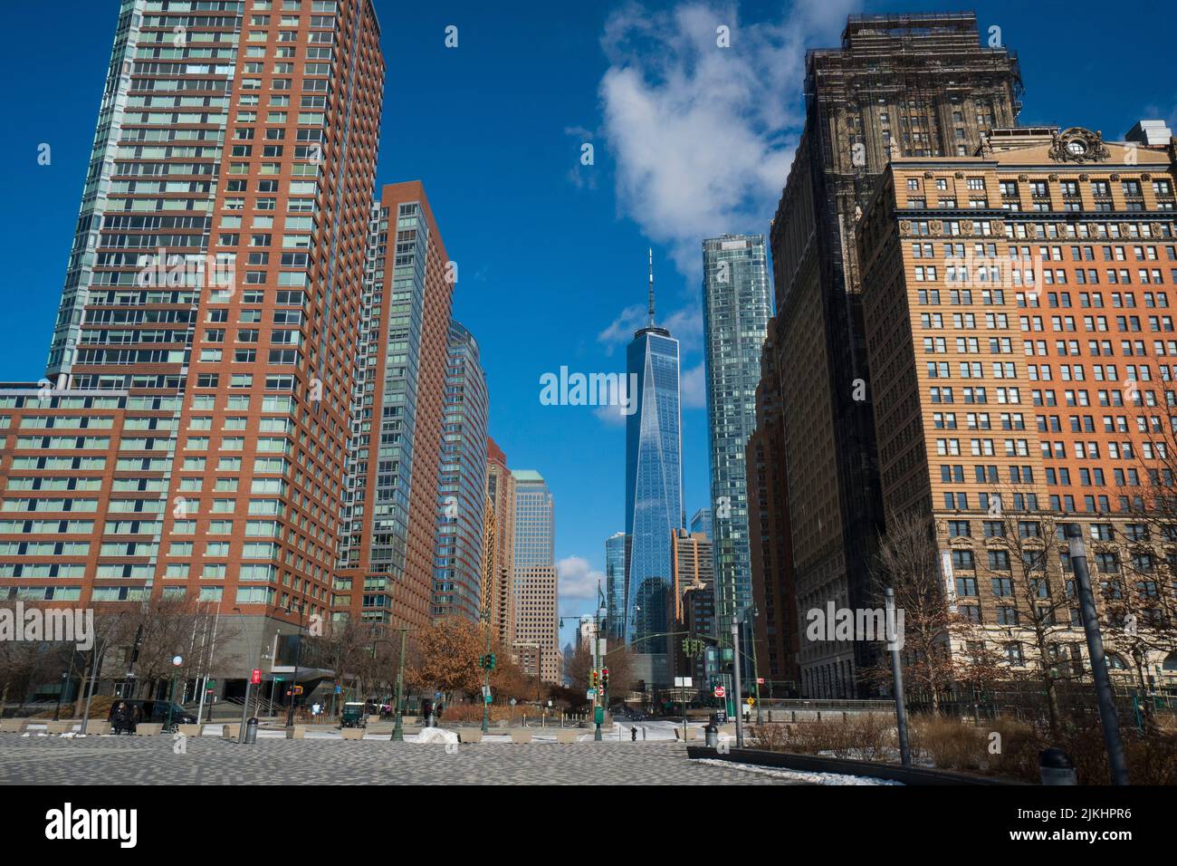 A low angle shot of the beautiful New York cityscape in South Manhattan under a cloudy blue sky Stock Photo