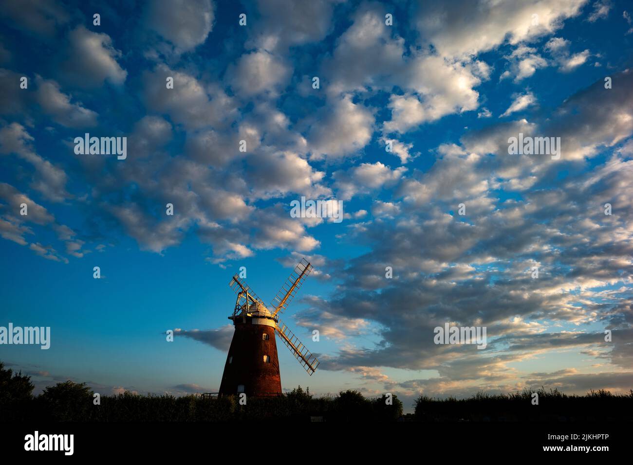 Thaxted Essex England Thaxted Windmill July 2022 John Webb’s Windmill also known as Thaxted Windmill in late evening sunlight against a mackerel sky. Stock Photo