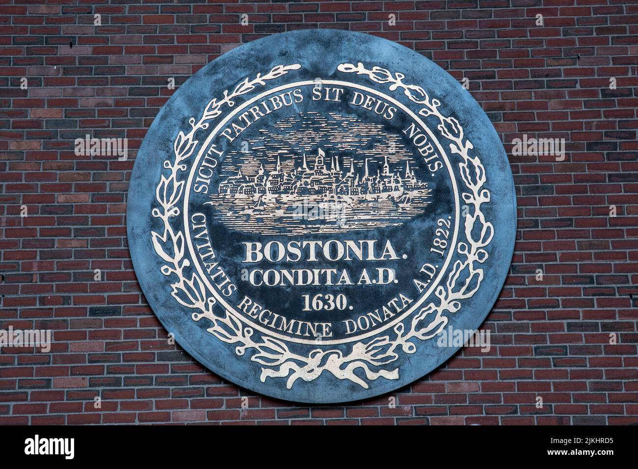 A close-up shot of a huge Bostonia Condita banner on a brick wall in Boston. Stock Photo