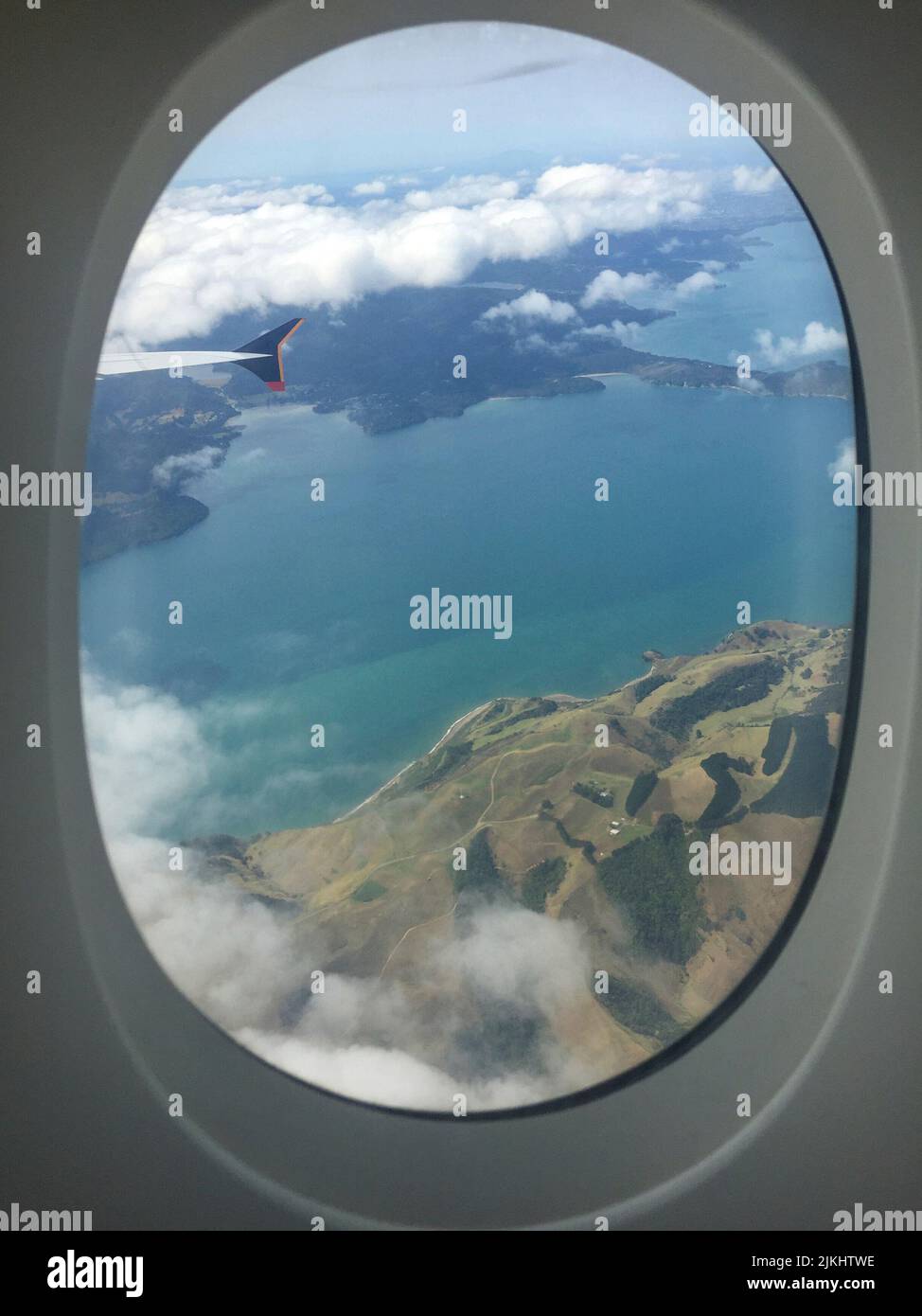 Looking out from an airplane window to the landscape of New Zealand's North Island Stock Photo