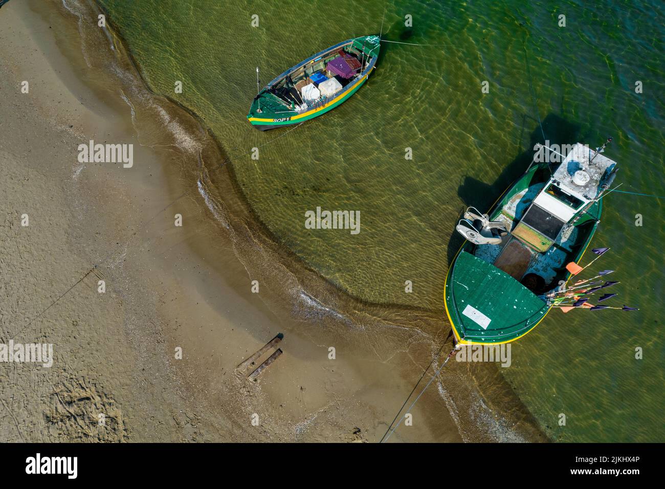 A 90-degree top view from a drone  to a Baltic sea and fishing boats in Sopot, Poland Stock Photo