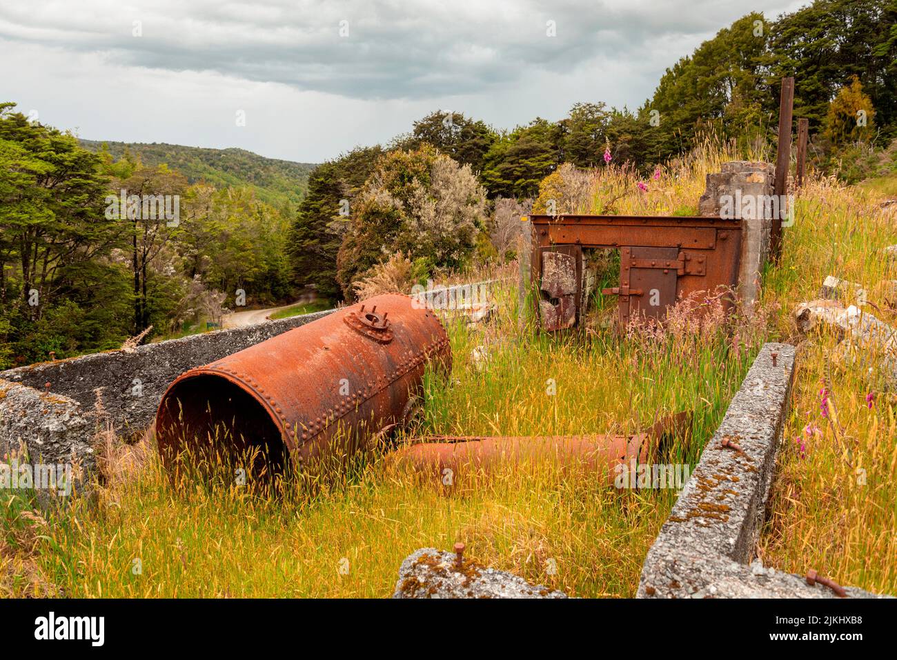 Remains in the landscape of an old mining factory in the ghost town of Waiuta, South Island of New Zealand Stock Photo
