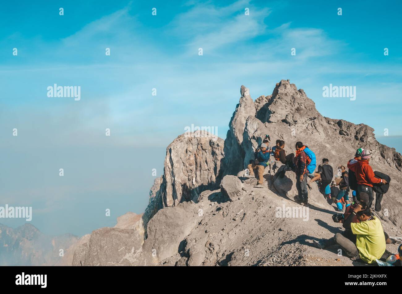 A beautiful shot of a group people in Merapi's Summit on a sunny morning Stock Photo