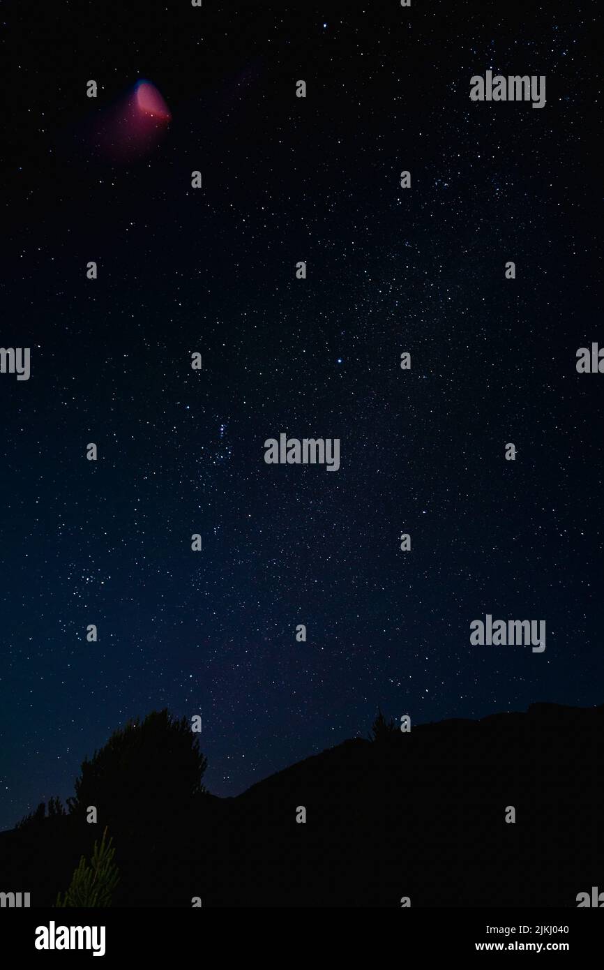 A vertical shot of the beautiful starry sky Stock Photo - Alamy