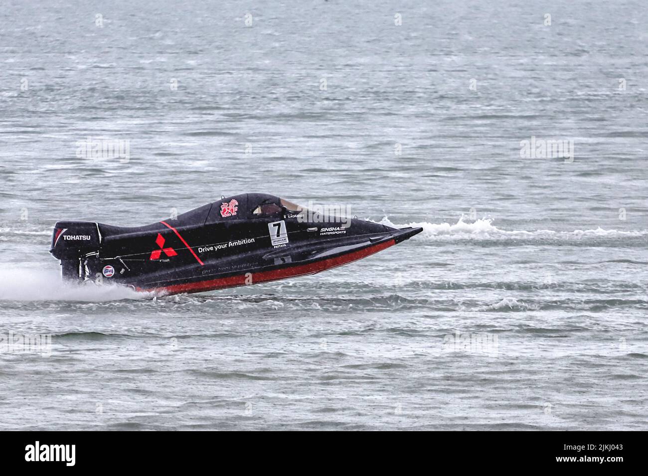 Red Powerboat Racing A black and red powerboat at the powerboat competition in Bang Saray ...