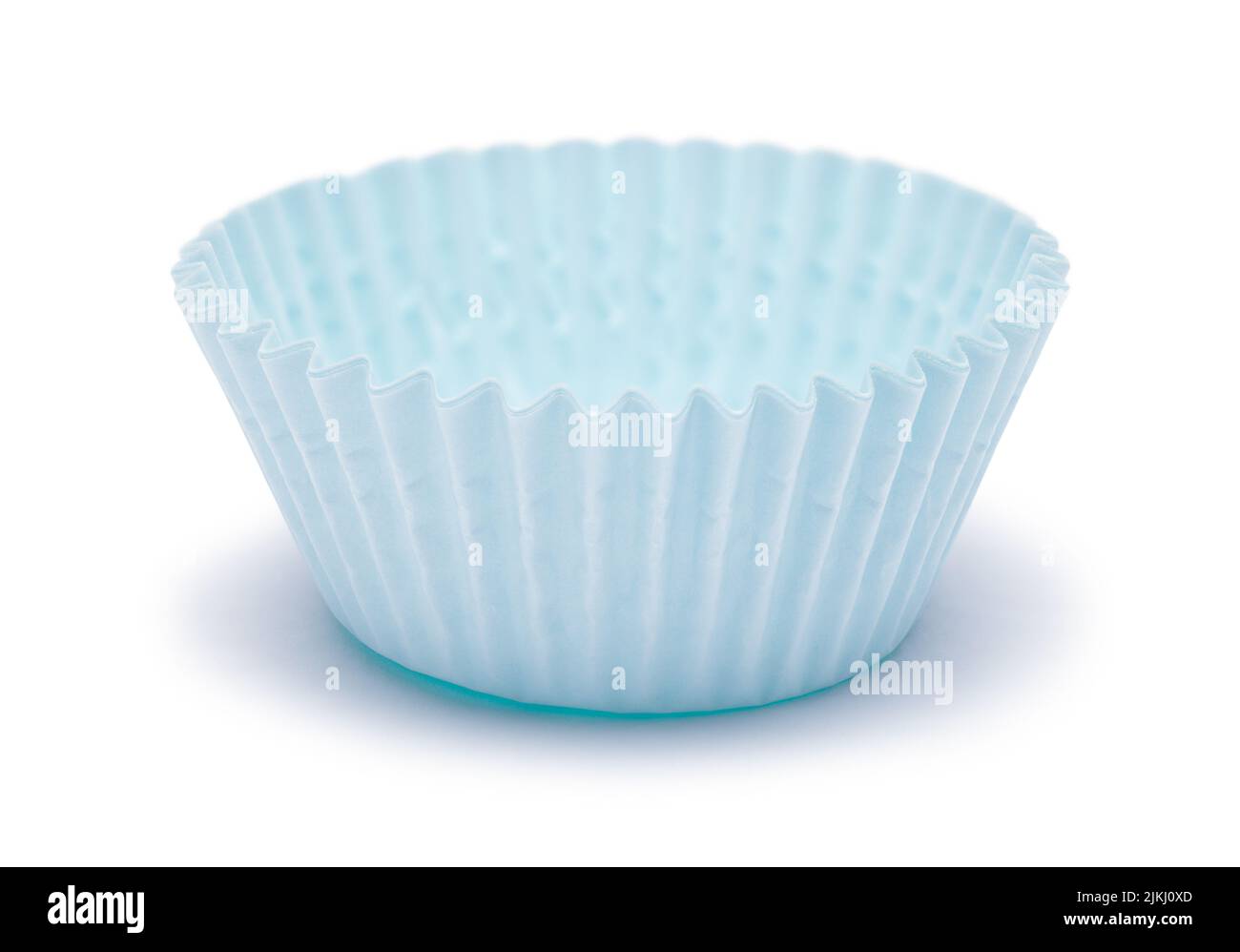 Blue Paper Cupcake Wrapper Cut Out on White. Stock Photo