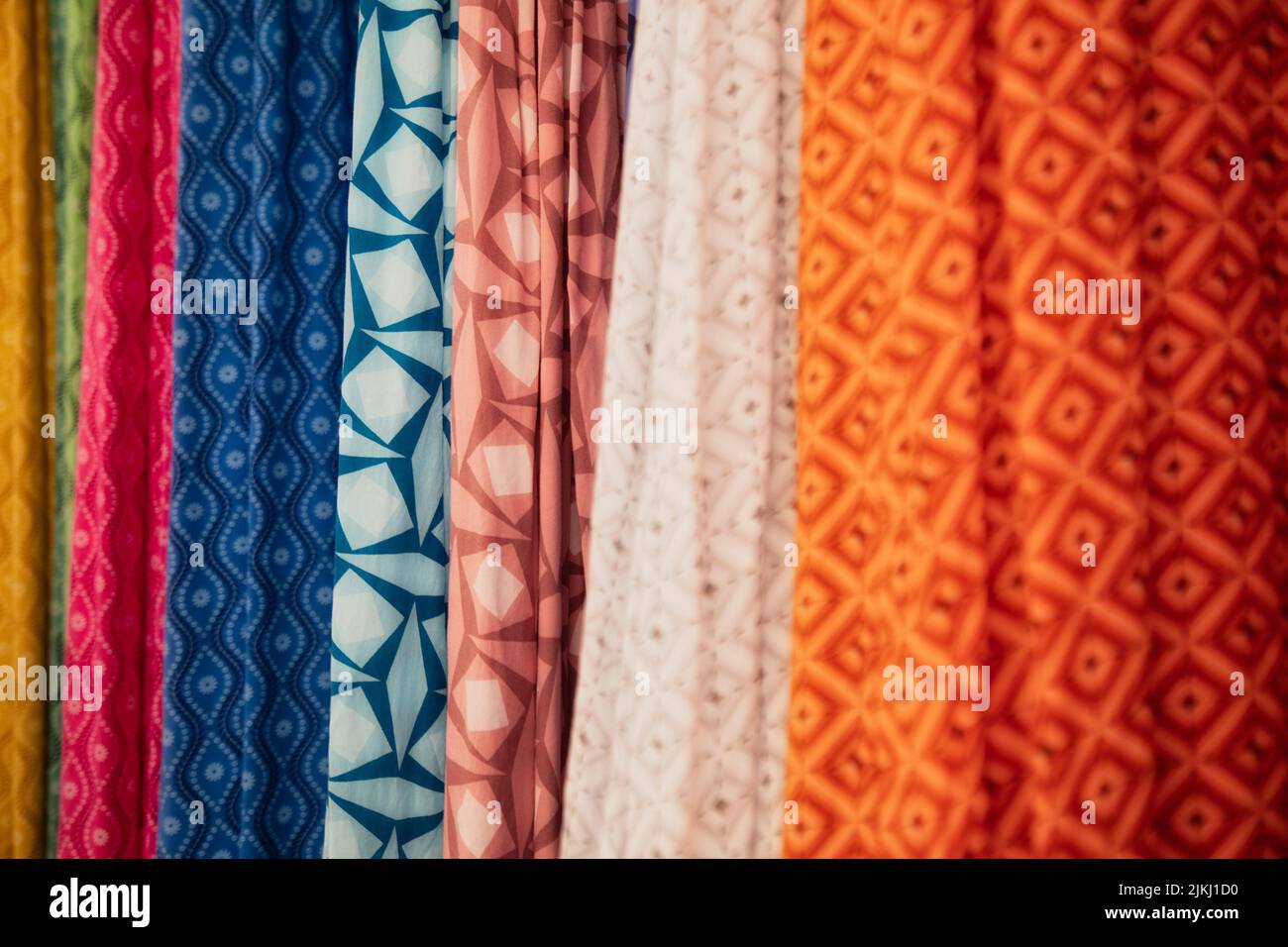 Spain, Balearic islands, Mallorca, district of Manacor, Calas de Mallorca. Colorful beach clothes for sale in the shops in the city center, close up view of the fabric Stock Photo