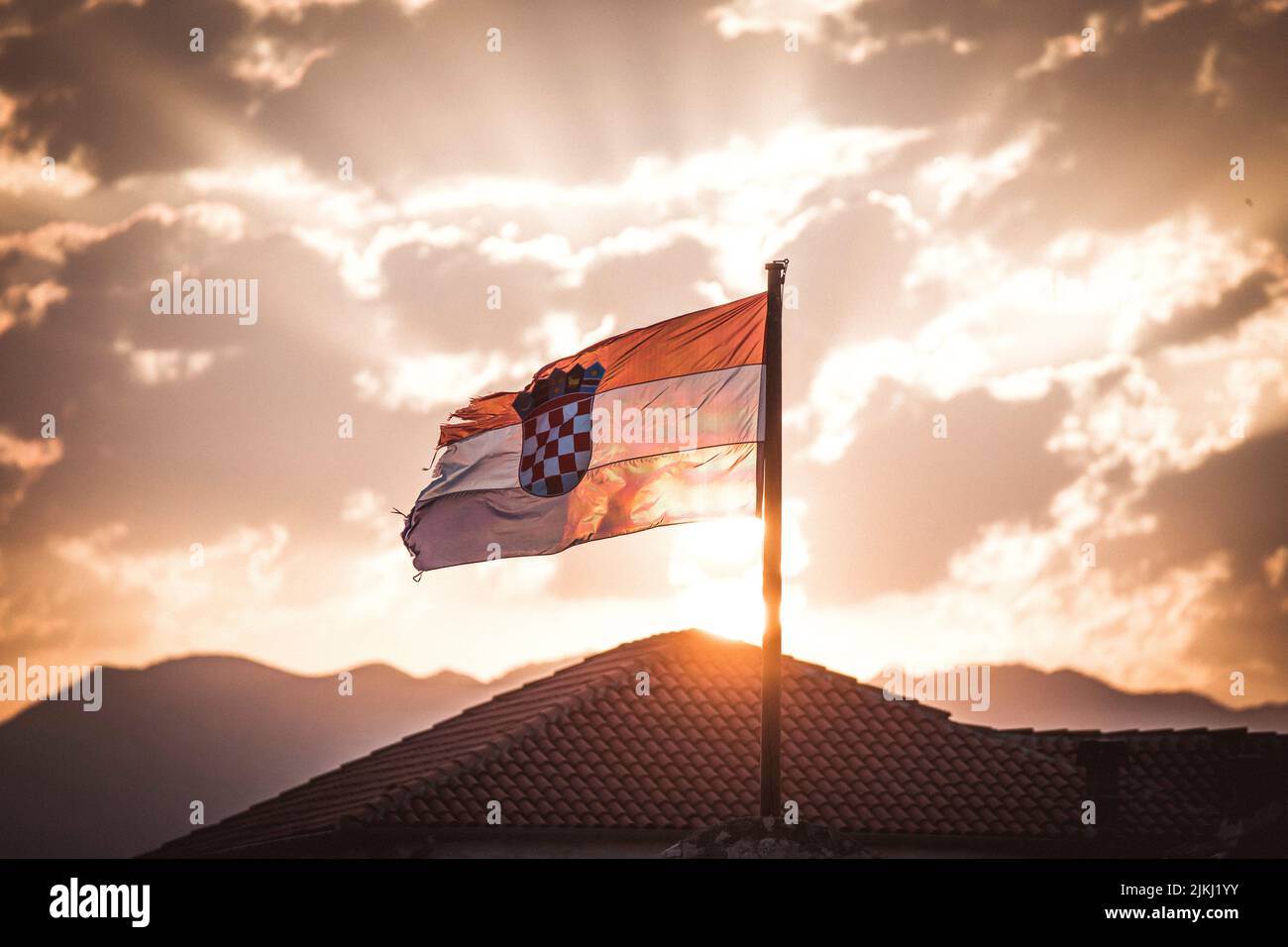 Croatian flag in sunrise and clouds Stock Photo