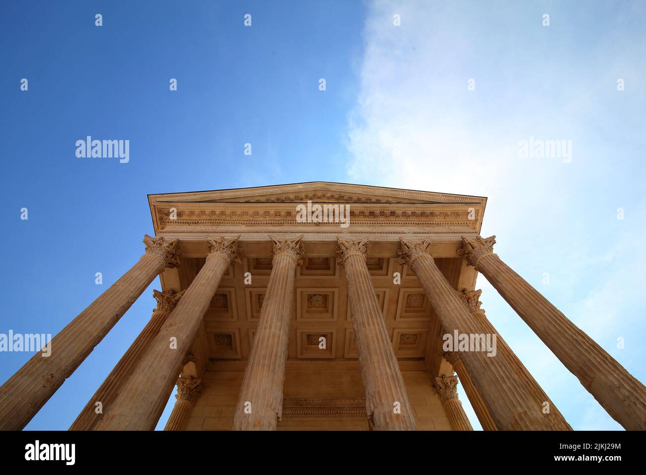 The Maison carree is a six columned portico with the facade of a classical temple in Nimes, France Stock Photo