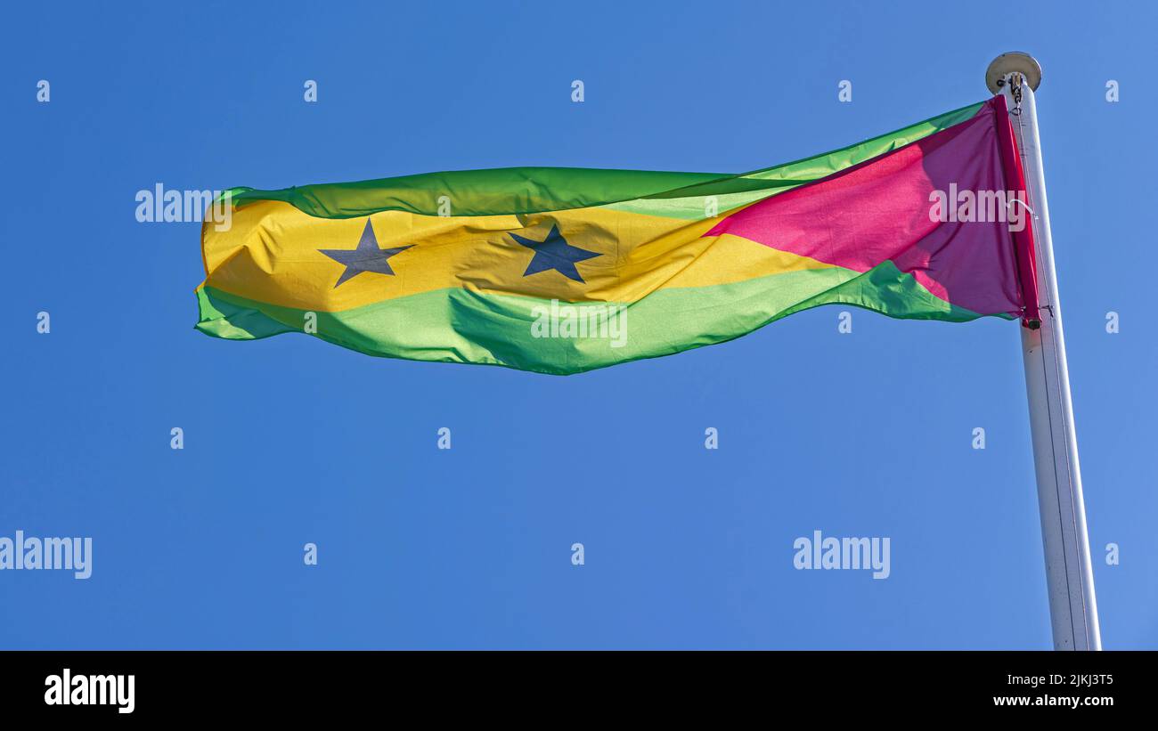 National Flag of Sao Tome and Principe Democratic Republic Country at Sunny Day Stock Photo