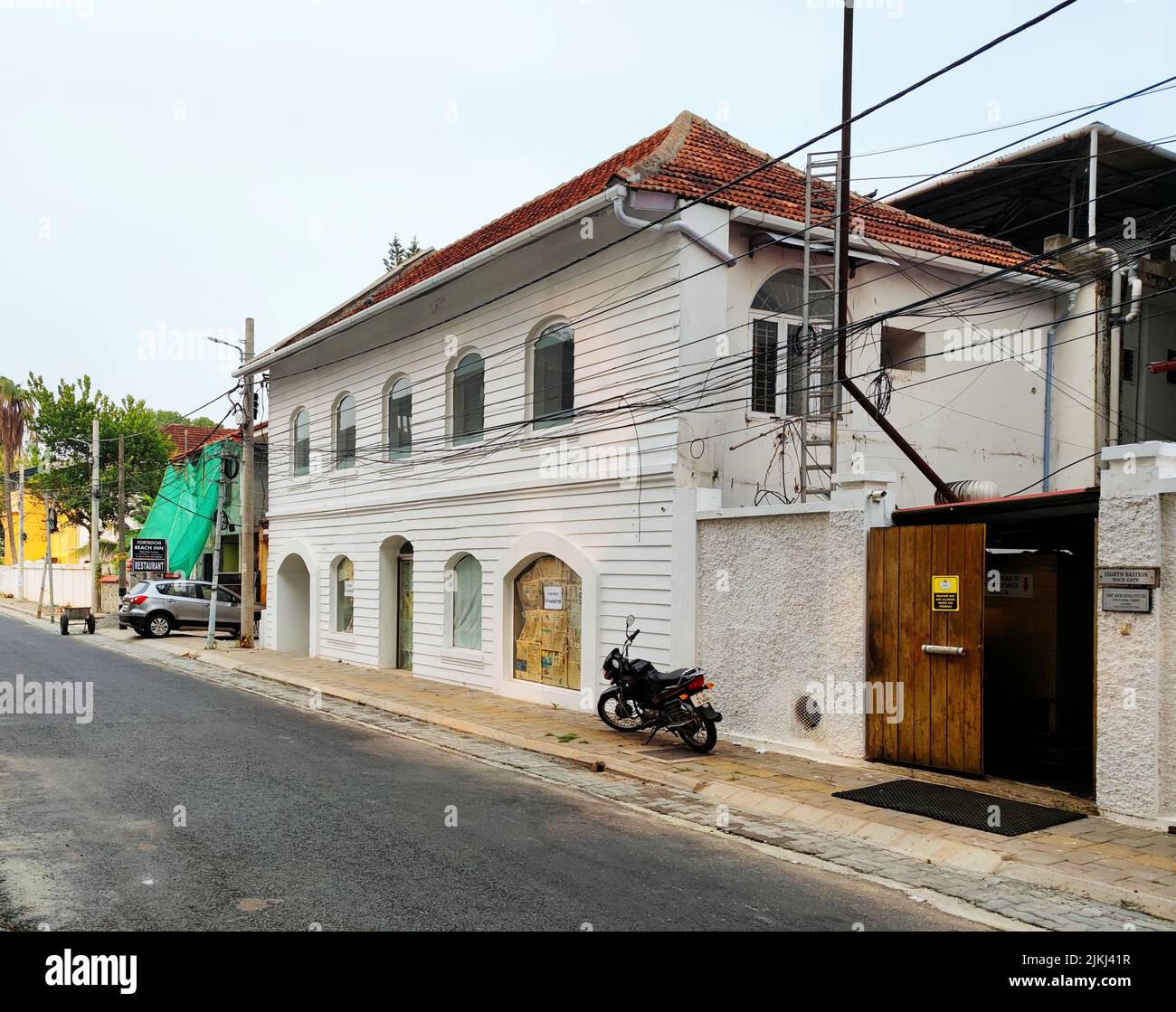 A beautiful shot of a heritage old white building at Fort Kochi against
