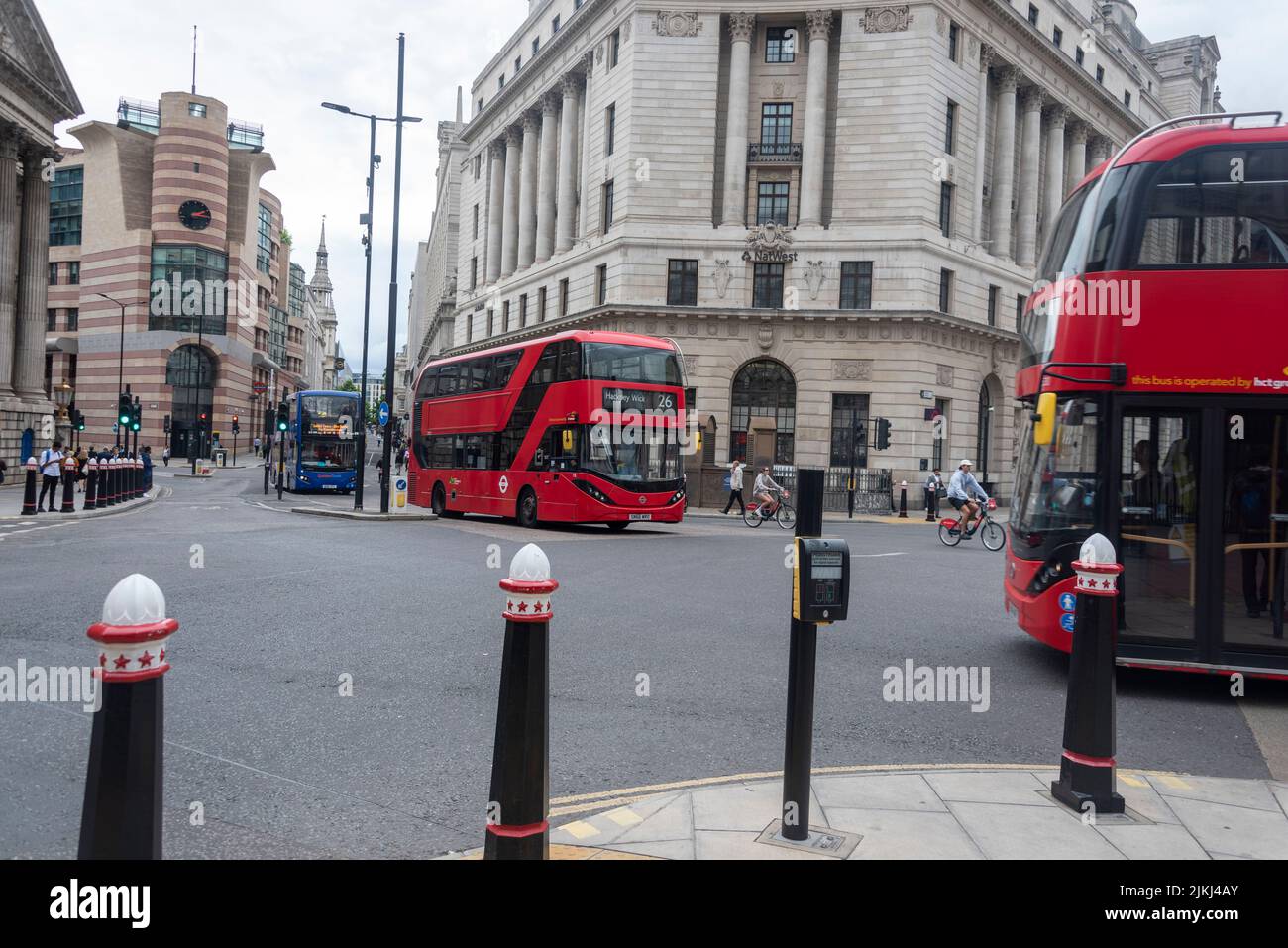 View of postmodern office and commercial building No 1 Poultry in London, near Bank of England, red double decker buses, Great Britain Stock Photo