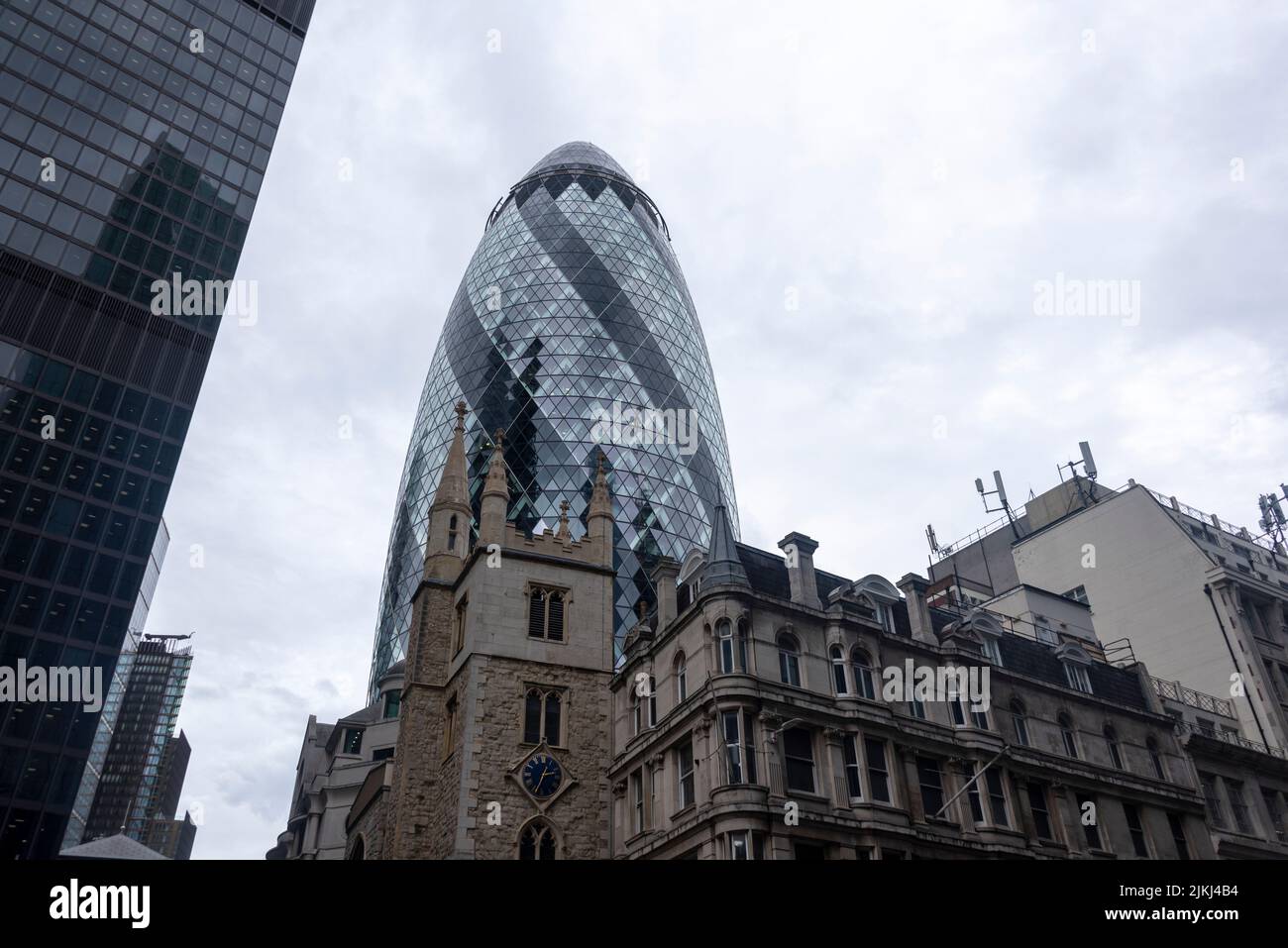 Church St Andrew Undershaft, behind Swiss Re Tower, 30 St Mary Axe, also called The Gherkin, financial district City of London, London, United Kingdom Stock Photo