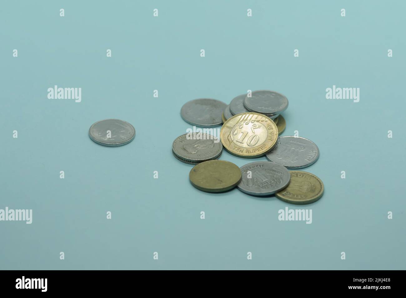 The Indian  1, 5, 10 rupee coins on the blue background Stock Photo