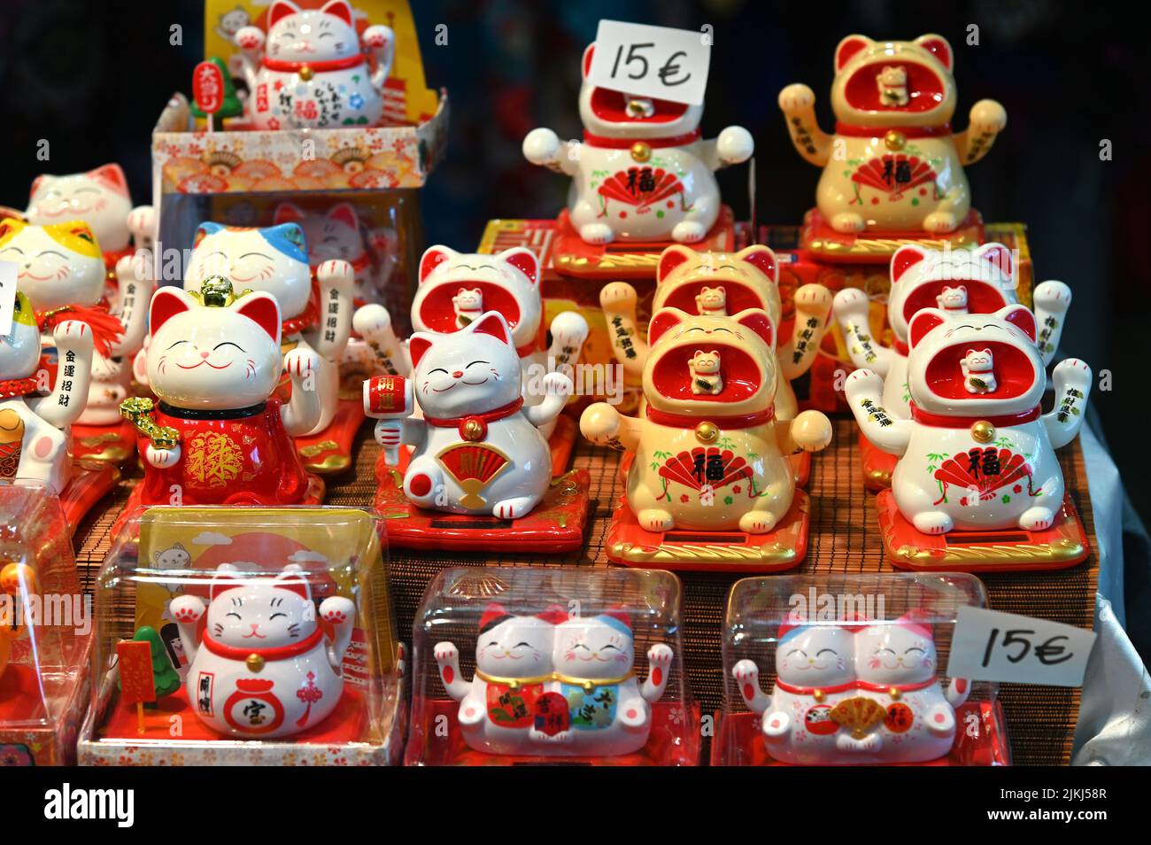 The welcoming cat oriental souvenirs on sale in oriental fair selective in Turin, Italy Stock Photo