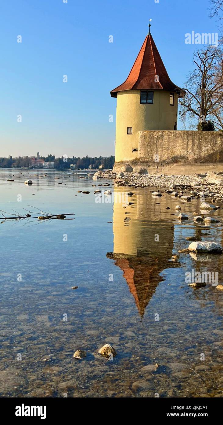 The Tower Pulverturm in Lindau mirroring in Bodensee water Stock Photo
