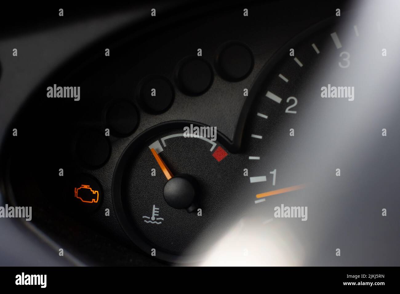 Yellow lit engine error sign on car dashboard close up Stock Photo Alamy