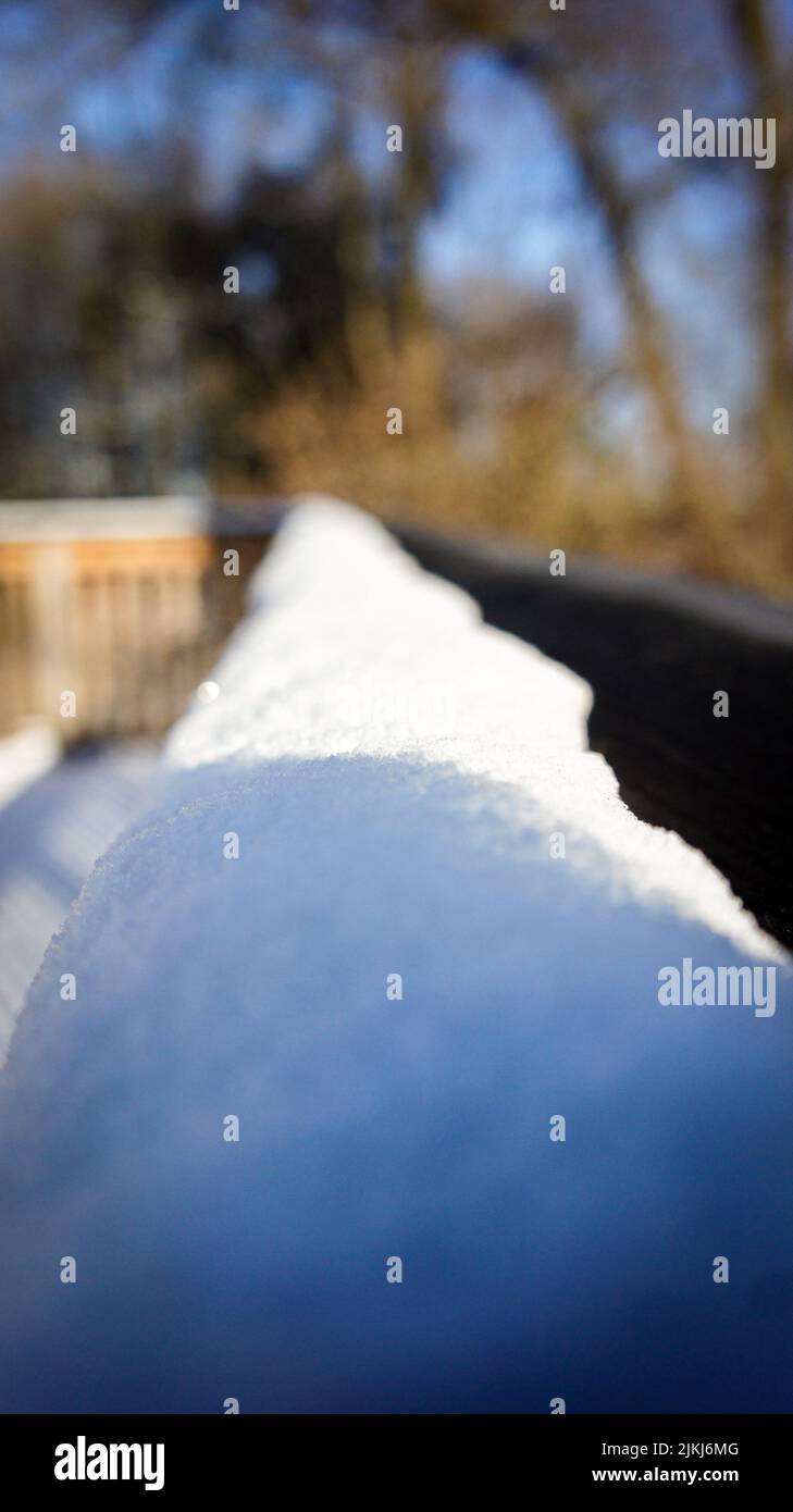 A selective of the snow covering a railing Stock Photo - Alamy