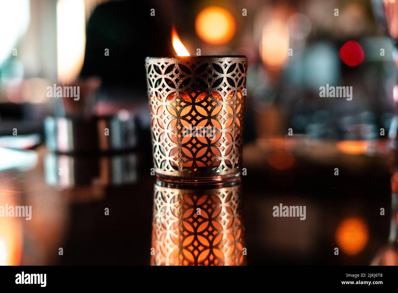 Traditional candle with its reflection inside a hotel Stock Photo Alamy