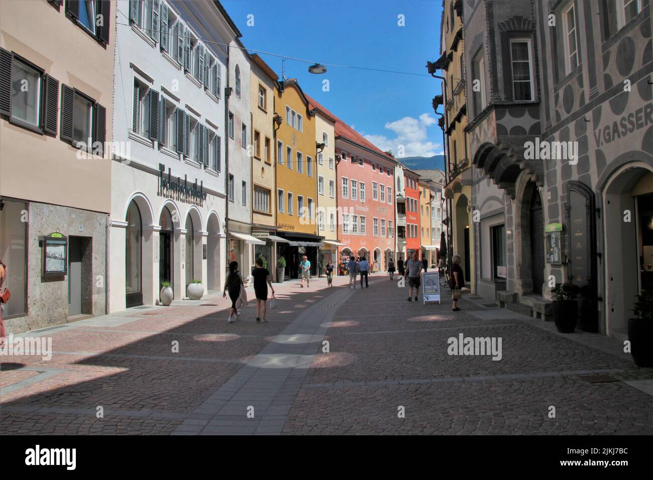Italy, South Tyrol, Brunico, old town, houses, tourists Stock Photo