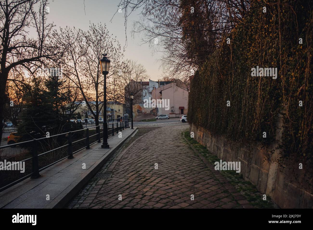 An old narrow street with a cobblestone pavement in the old town of Cieszyn Stock Photo