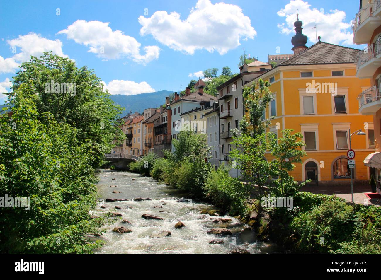 Italy, South Tyrol, Bruneck, river Rienz, old town, houses, tower of Rain church Stock Photo