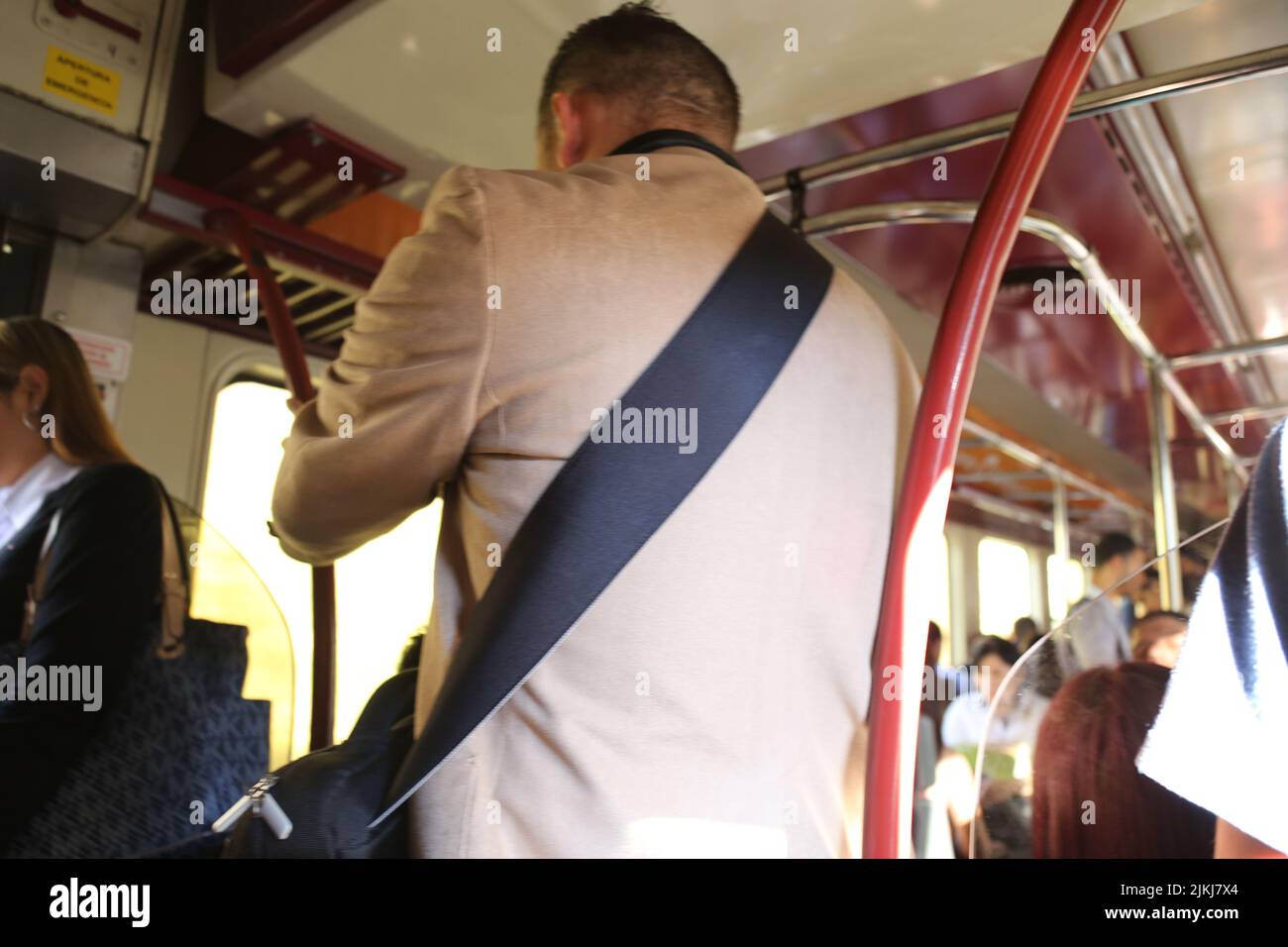 A rear view of a man on the train moving to the city Stock Photo - Alamy