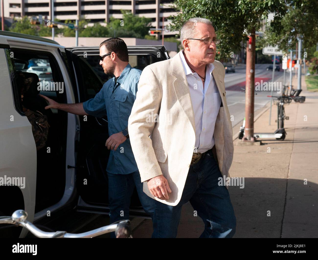 Austin, United States. 02nd Aug, 2022. Austin, United States. 2nd Aug, 2022. Under heavy security, father NEIL HESLIN arrives during the start of Day 6 in the defamation trial of Alex Jones (not shown) and InfoWars at the Travis County Courthouse on August 2, 2022. Jones is expected to testify in the closing days of the trial. Heslin's son, Jesse was killed in the Sandy Hook massacre. Credit: Bob Daemmrich/Alamy Live News Stock Photo