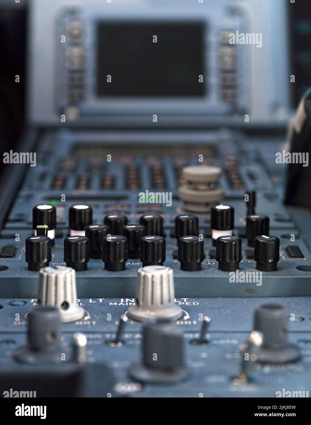 A closeup shot of radio buttons inside the Airbus 320 cockpit plane Stock Photo